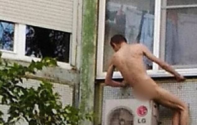 Голый мужик забрался на соседский кондиционер чтобы прохладиться